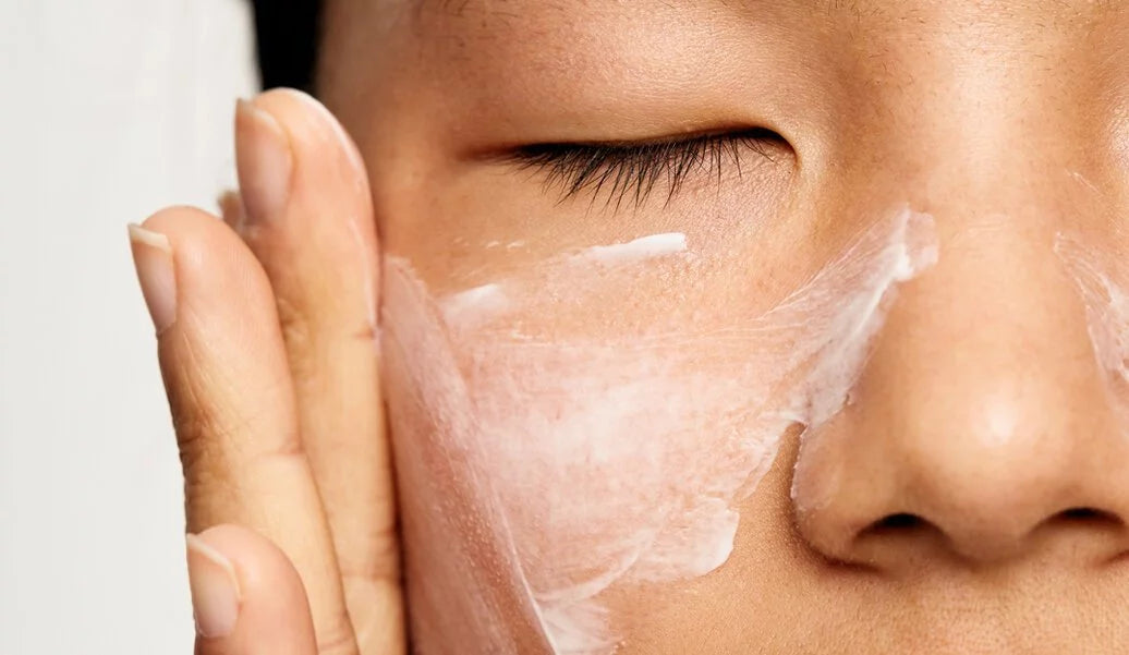 Woman Applying Moisturiser on Face